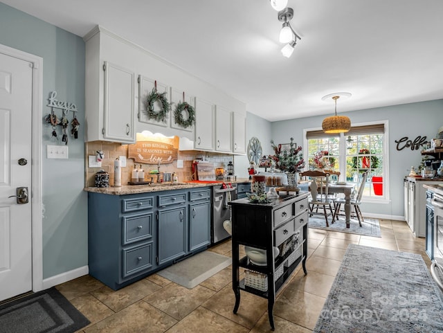 kitchen featuring dishwasher, hanging light fixtures, decorative backsplash, light tile patterned flooring, and white cabinetry