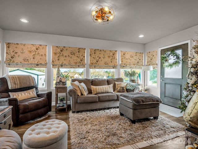 living room featuring wood-type flooring and plenty of natural light