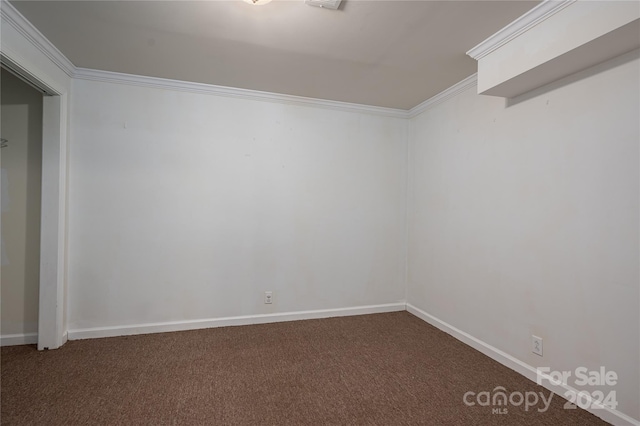 carpeted empty room with ornamental molding