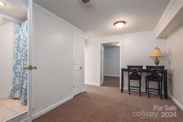 hall with carpet and ornamental molding