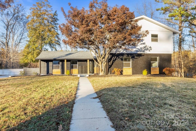 view of front of property with a front lawn