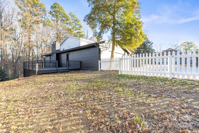 view of property exterior featuring a deck