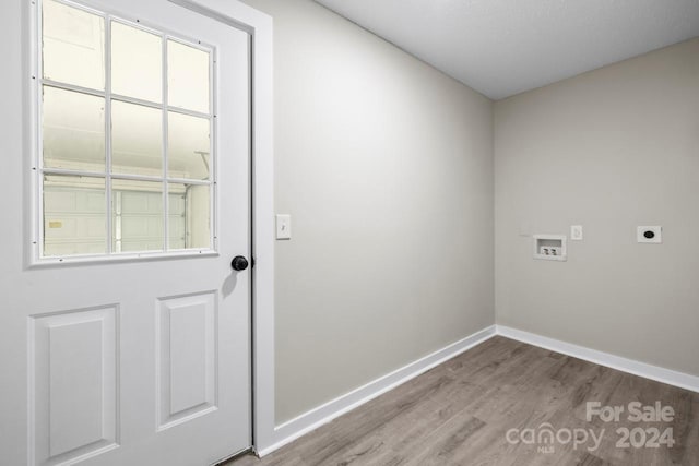 washroom with hardwood / wood-style floors, electric dryer hookup, and hookup for a washing machine