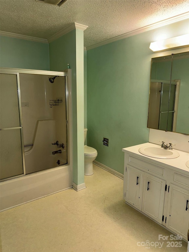 full bathroom featuring ornamental molding, a textured ceiling, vanity, shower / bath combination with glass door, and toilet