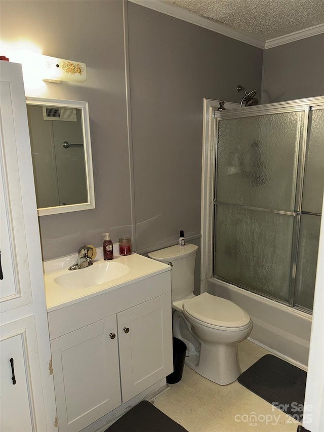 full bathroom with ornamental molding, bath / shower combo with glass door, a textured ceiling, vanity, and toilet