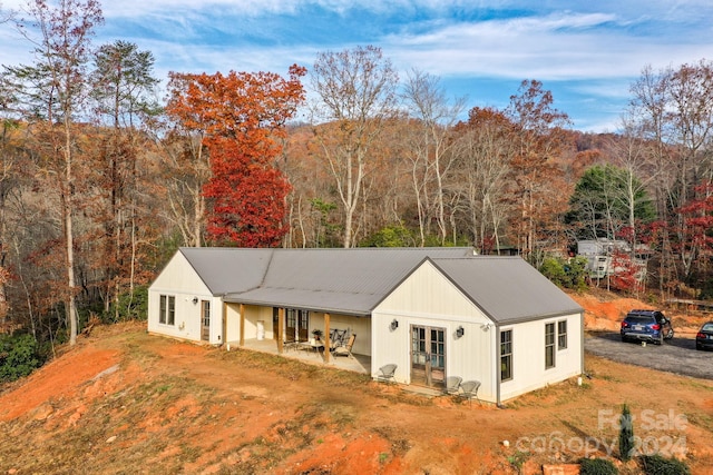 view of front of property featuring a patio area and french doors