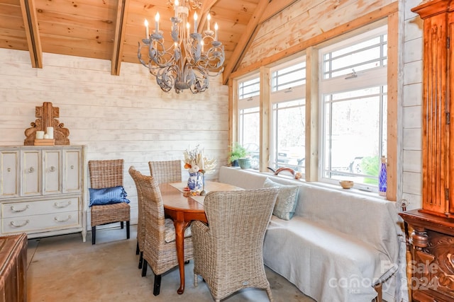 dining area featuring a chandelier, wooden walls, lofted ceiling, and wood ceiling