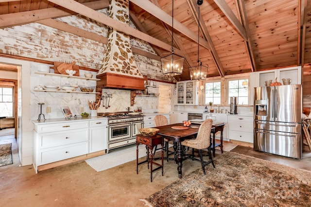 dining area featuring beamed ceiling, plenty of natural light, and wood ceiling