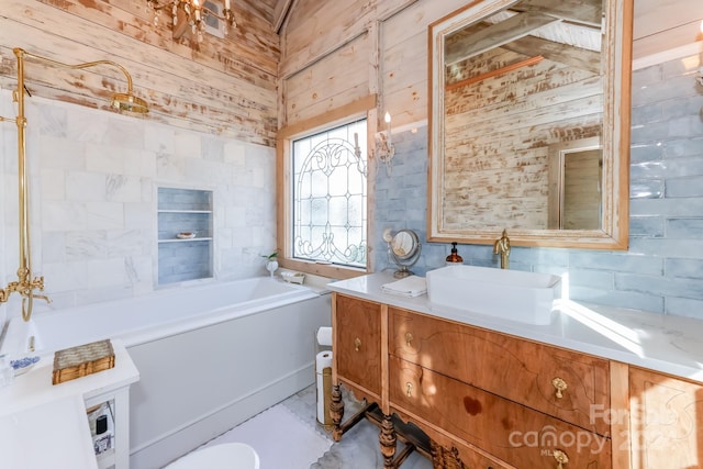 bathroom with a tub, wood walls, and vanity