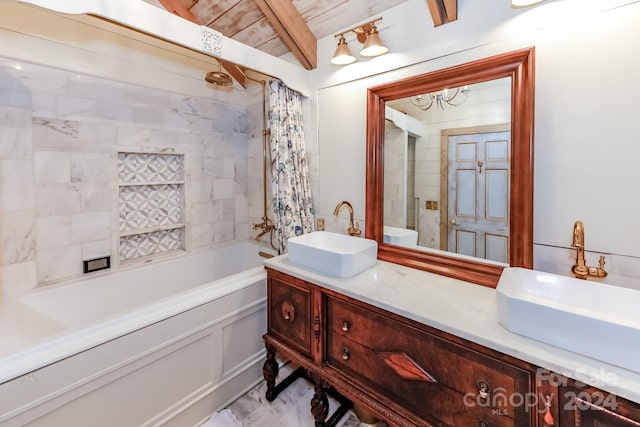 bathroom featuring vanity, beamed ceiling, wood ceiling, and tiled shower / bath