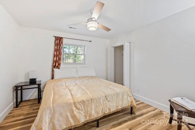 bedroom featuring hardwood / wood-style floors and ceiling fan