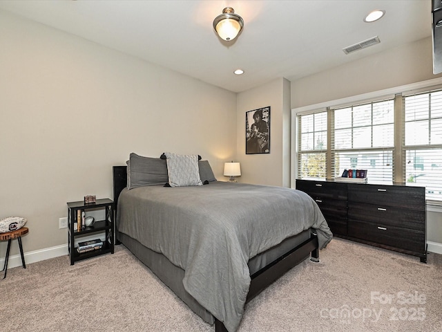 bedroom with light colored carpet