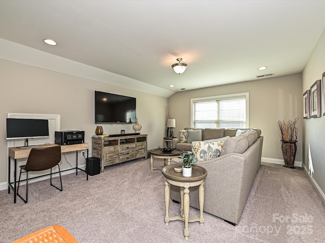 carpeted living room featuring lofted ceiling