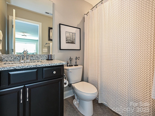 bathroom with tile patterned flooring, vanity, a shower with shower curtain, and toilet