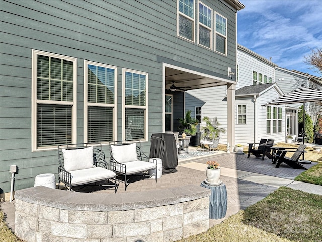 view of patio / terrace featuring ceiling fan