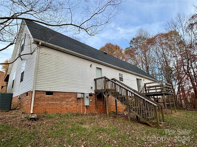 back of house featuring a wooden deck