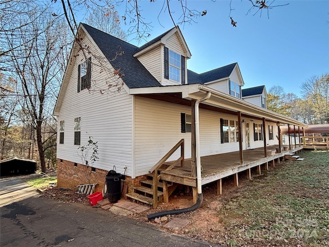 view of home's exterior featuring covered porch