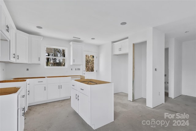 kitchen with a center island and white cabinets