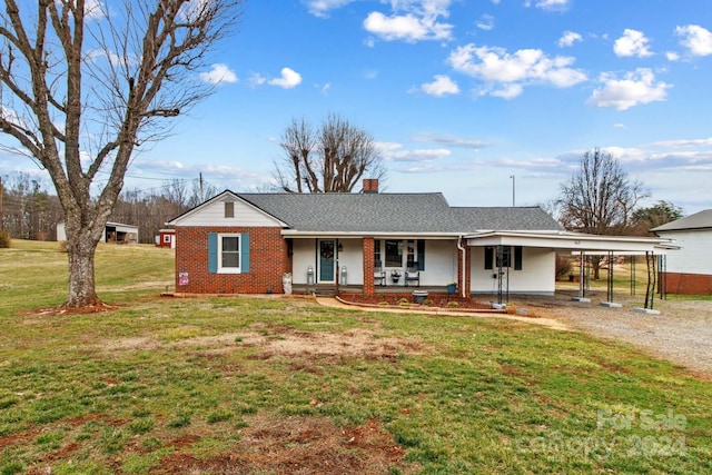 ranch-style house with a carport, a porch, and a front lawn