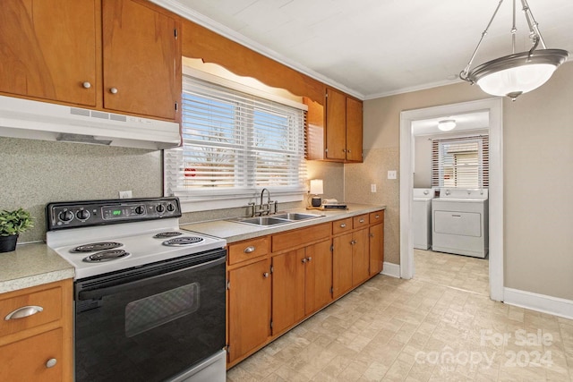 kitchen featuring electric stove, crown molding, sink, and washer and dryer