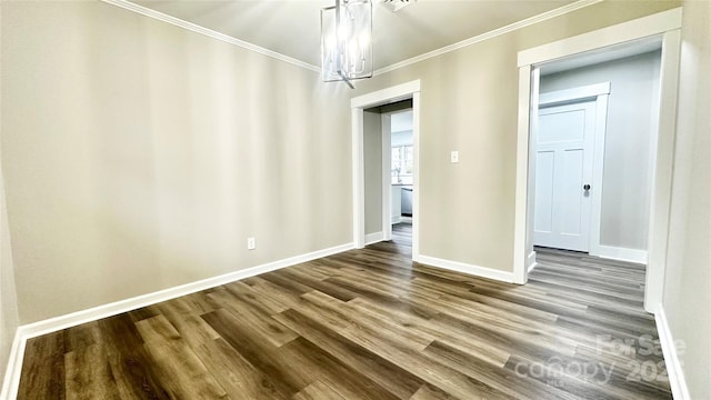 interior space with wood-type flooring, ornamental molding, and a notable chandelier