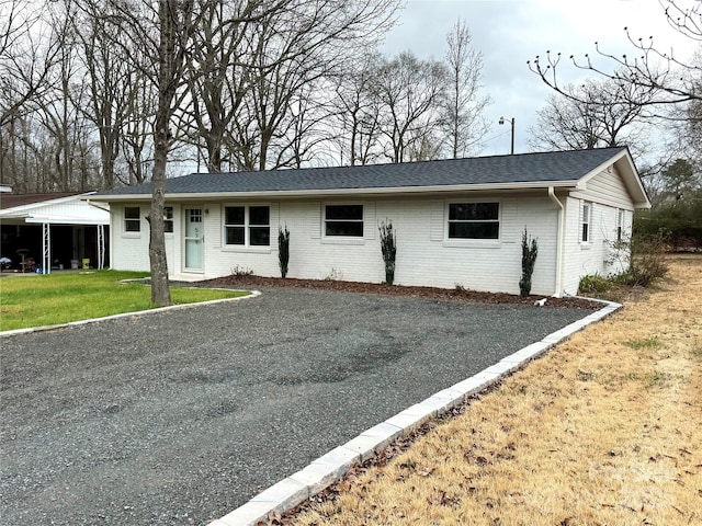 ranch-style home with a front yard