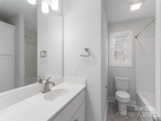 bathroom with tile patterned flooring, vanity, and toilet