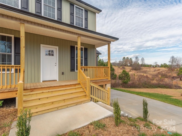 doorway to property with covered porch