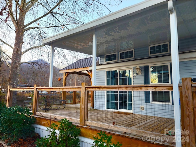 wooden terrace featuring a mountain view