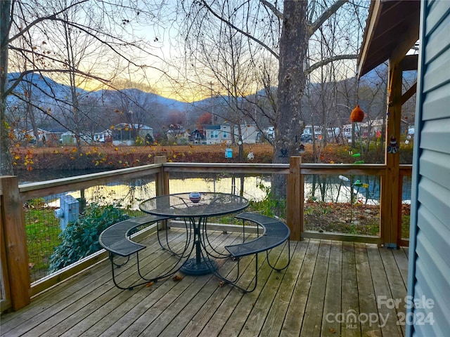 wooden terrace featuring a mountain view