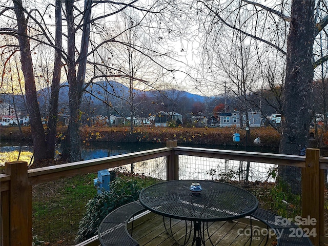 wooden deck featuring a mountain view