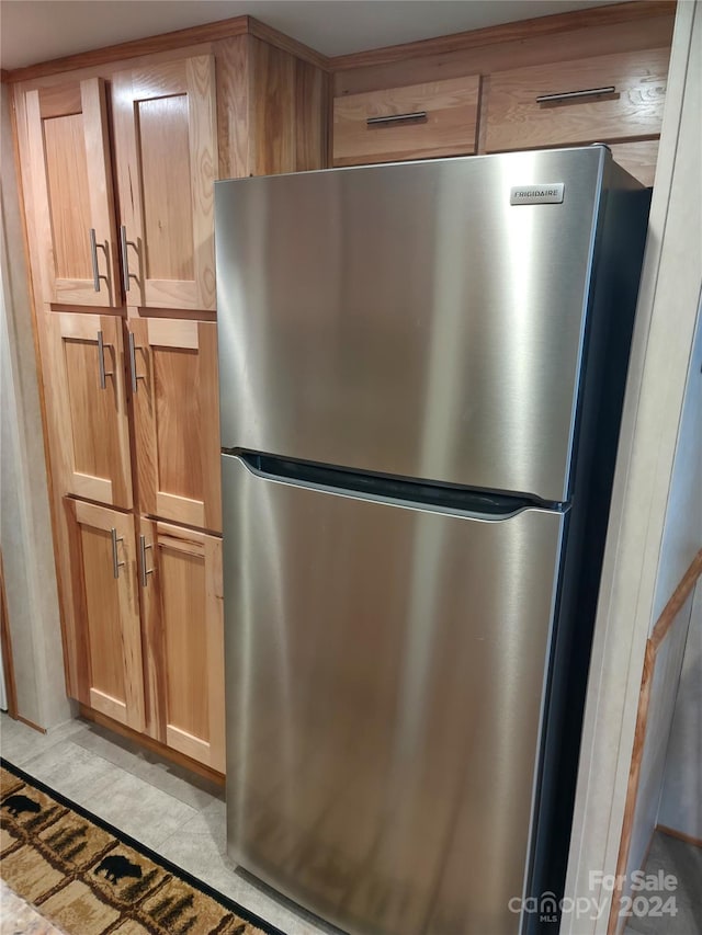 kitchen featuring stainless steel refrigerator