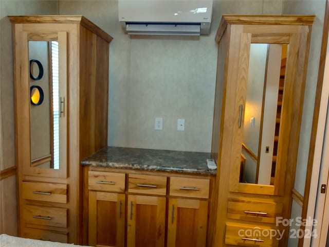 kitchen featuring a wall unit AC