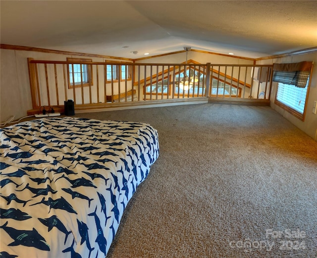 unfurnished bedroom featuring carpet and vaulted ceiling