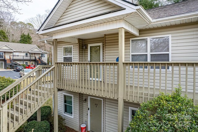 exterior space with a shingled roof