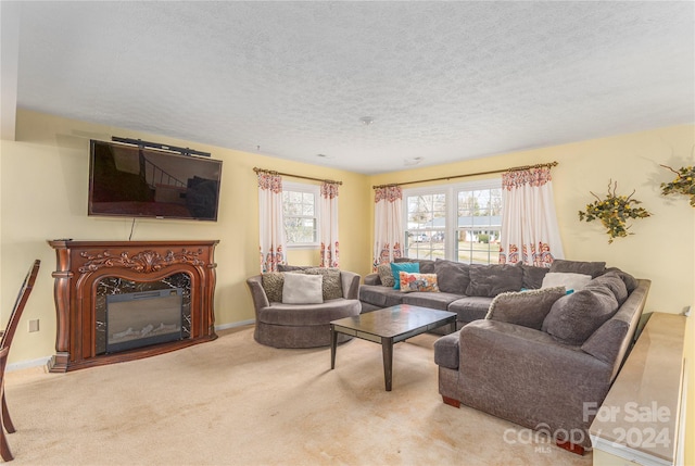 carpeted living room with a textured ceiling