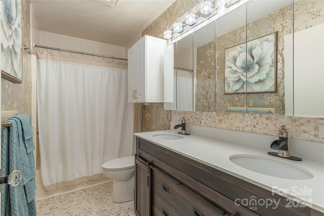 full bathroom featuring vanity, toilet, and shower / bathtub combination with curtain