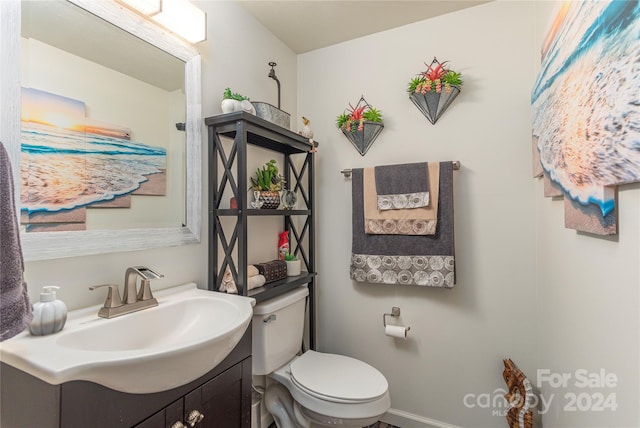 bathroom featuring vanity and toilet