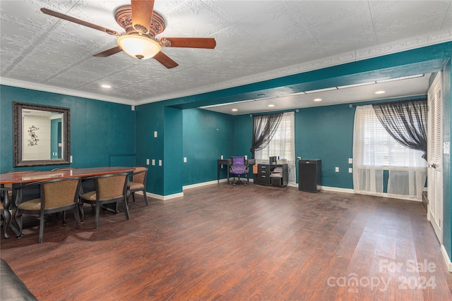 misc room featuring ceiling fan, dark hardwood / wood-style floors, and ornamental molding