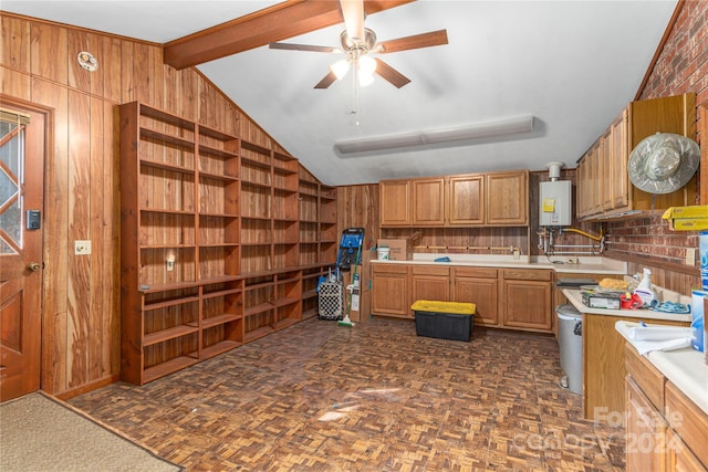 kitchen featuring wood walls, dark parquet floors, vaulted ceiling with beams, ceiling fan, and water heater