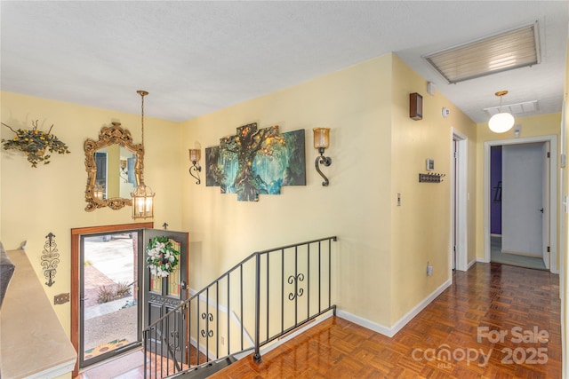 hallway with dark parquet floors