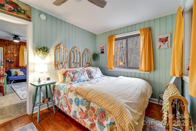 bedroom featuring ceiling fan and dark hardwood / wood-style floors