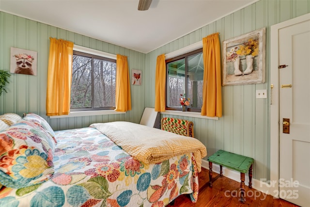 bedroom featuring ceiling fan and dark hardwood / wood-style floors