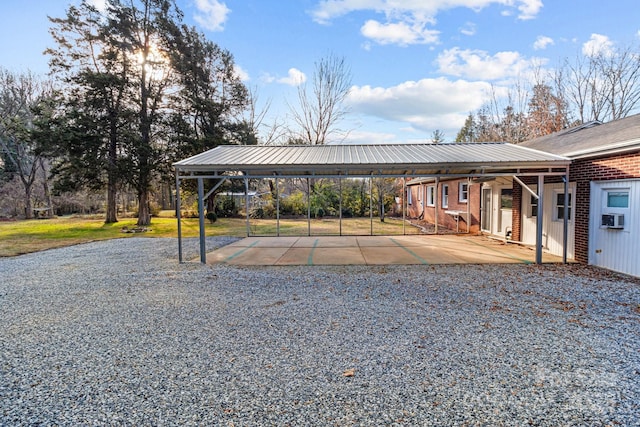 view of parking / parking lot with a carport and cooling unit