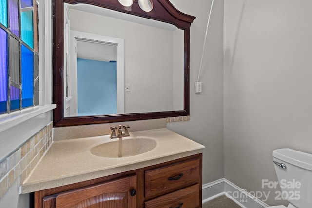 bathroom with vanity and toilet