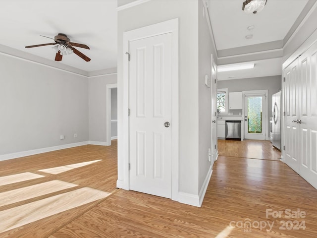 hall with hardwood / wood-style flooring and crown molding