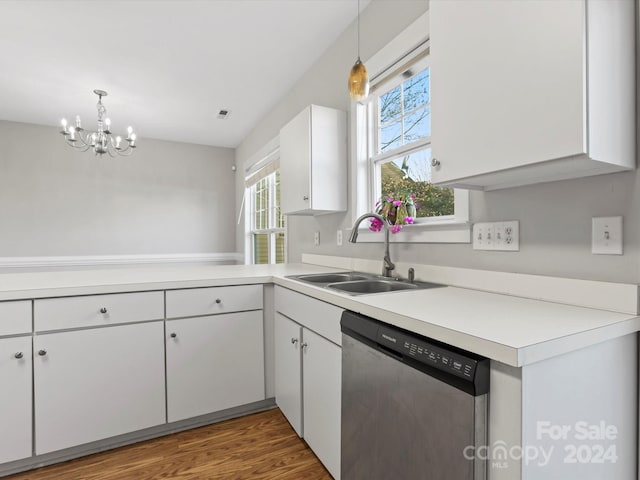 kitchen with stainless steel dishwasher, white cabinetry, sink, and a wealth of natural light