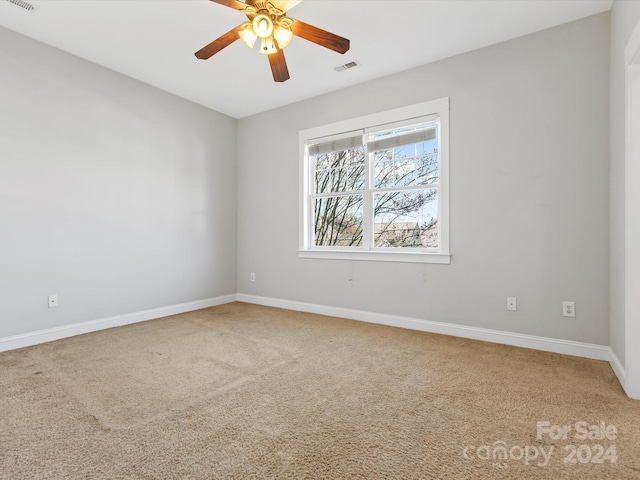 carpeted empty room with ceiling fan