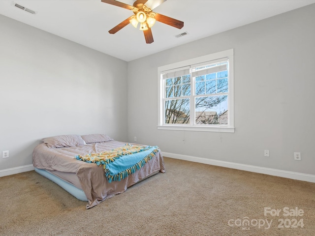 carpeted bedroom featuring ceiling fan