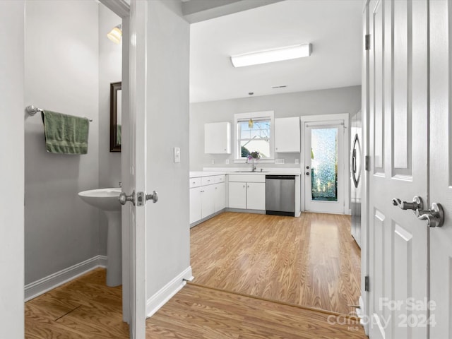 bathroom with hardwood / wood-style floors and sink